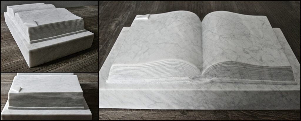 sculpture of a book in Carrara marble